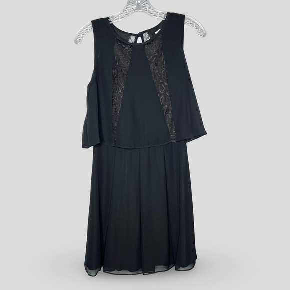 BCBGeneration Dresses & Skirts - BCBGeneration Sleeveless Black Flounce Dress